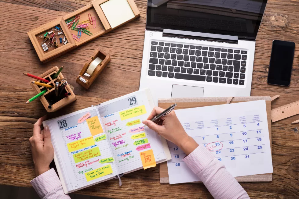 businesswoman-writing-schedule-calendar-diary