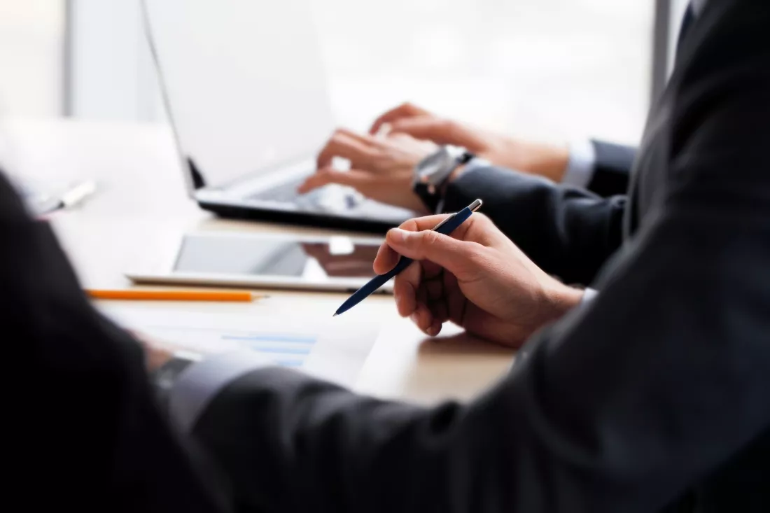 business-people-working-together-with-financial-reports