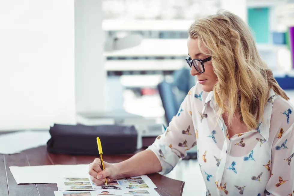 reviewing-documents-office-desk-creative-businesswoman-with-glasses-working-copy-space