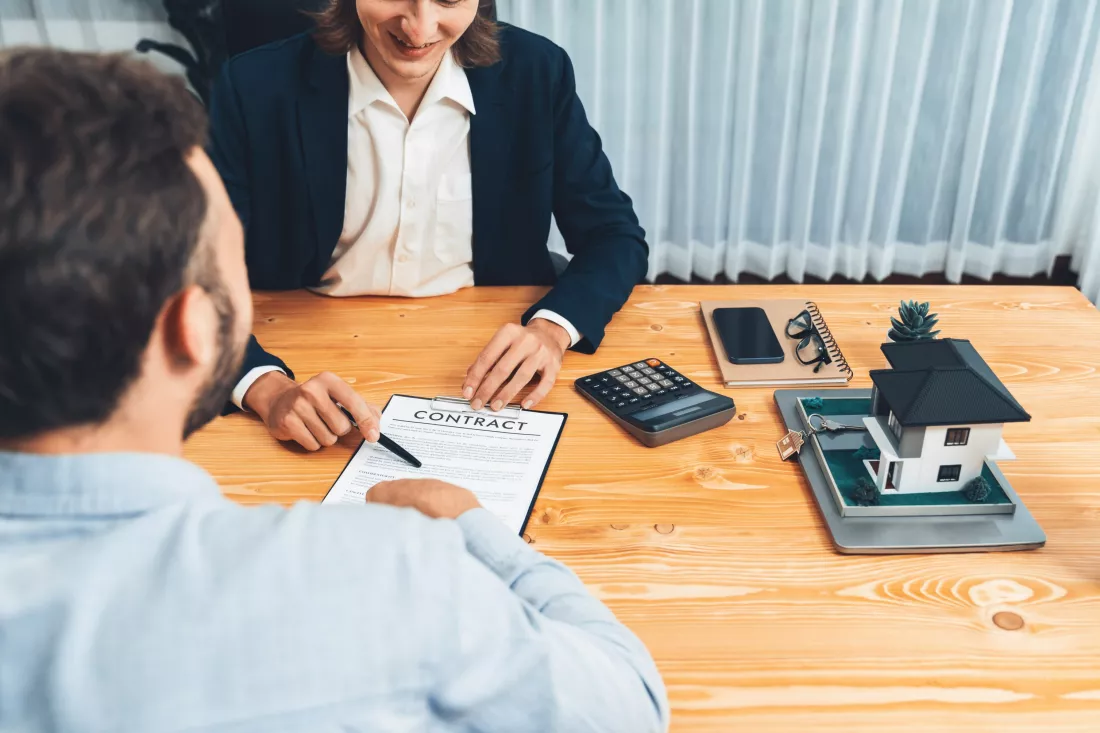 client-real-estate-agent-review-loan-contract-discussing-term-entity