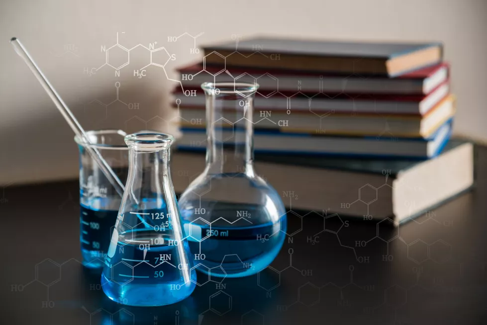digital-composite-image-liquids-molecular-structure-by-books-table