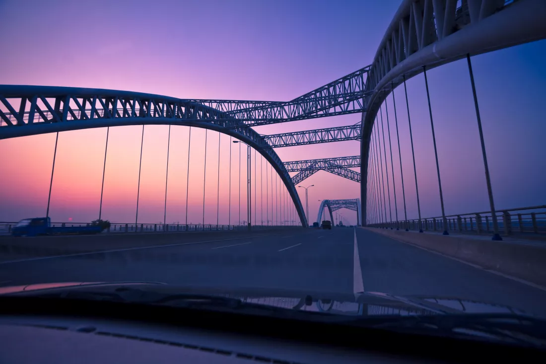 view-bridge-against-sky-seen-through-car-windshield