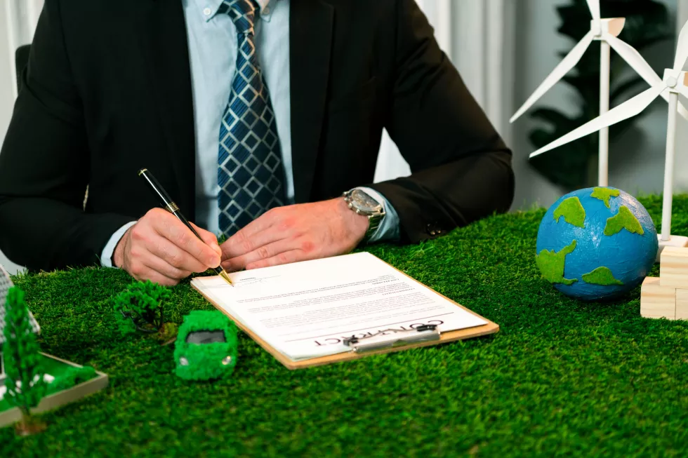 businessman-ceo-office-signing-environmental-regulation-agreement-save-earth-with-sustainable-energy-utilization-co2-reduction-greener-future-quaint